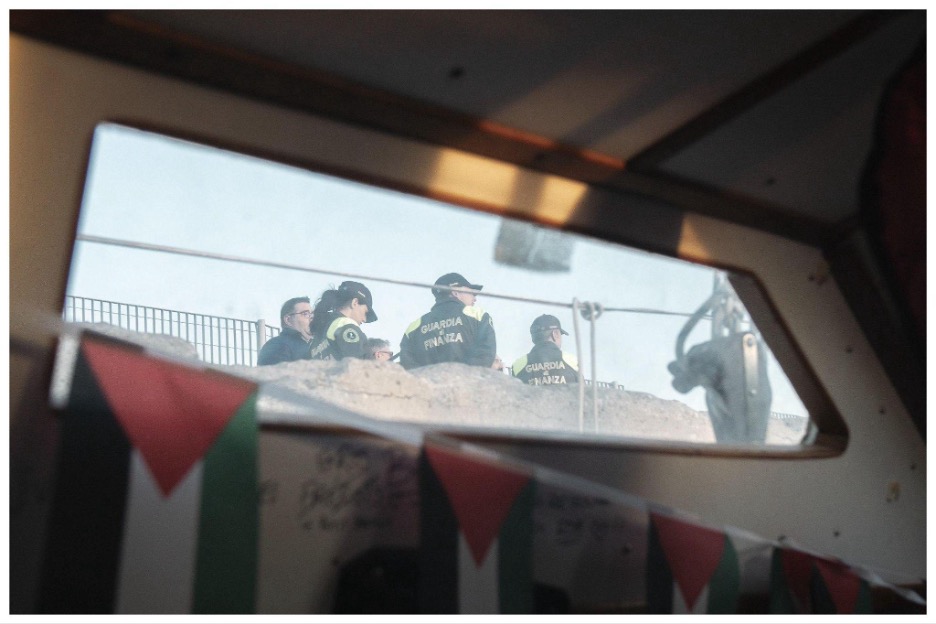 Guardia di Finanza officers seen from inside the cabin of a Global Sumud Flotilla sailboat in Livorno’s harbor on October 22, 2026.