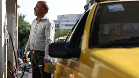 An Iranian man fills his car, on the verge of the rise in gasoline prices in Iran, at a gas station in Tehran, 7 September 2026 (Majid Asgaripour/WANA/Reuters)